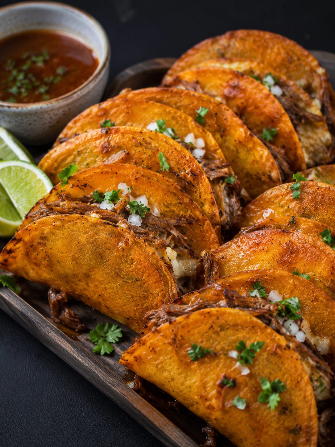Crispy birria tacos with dipping consommé